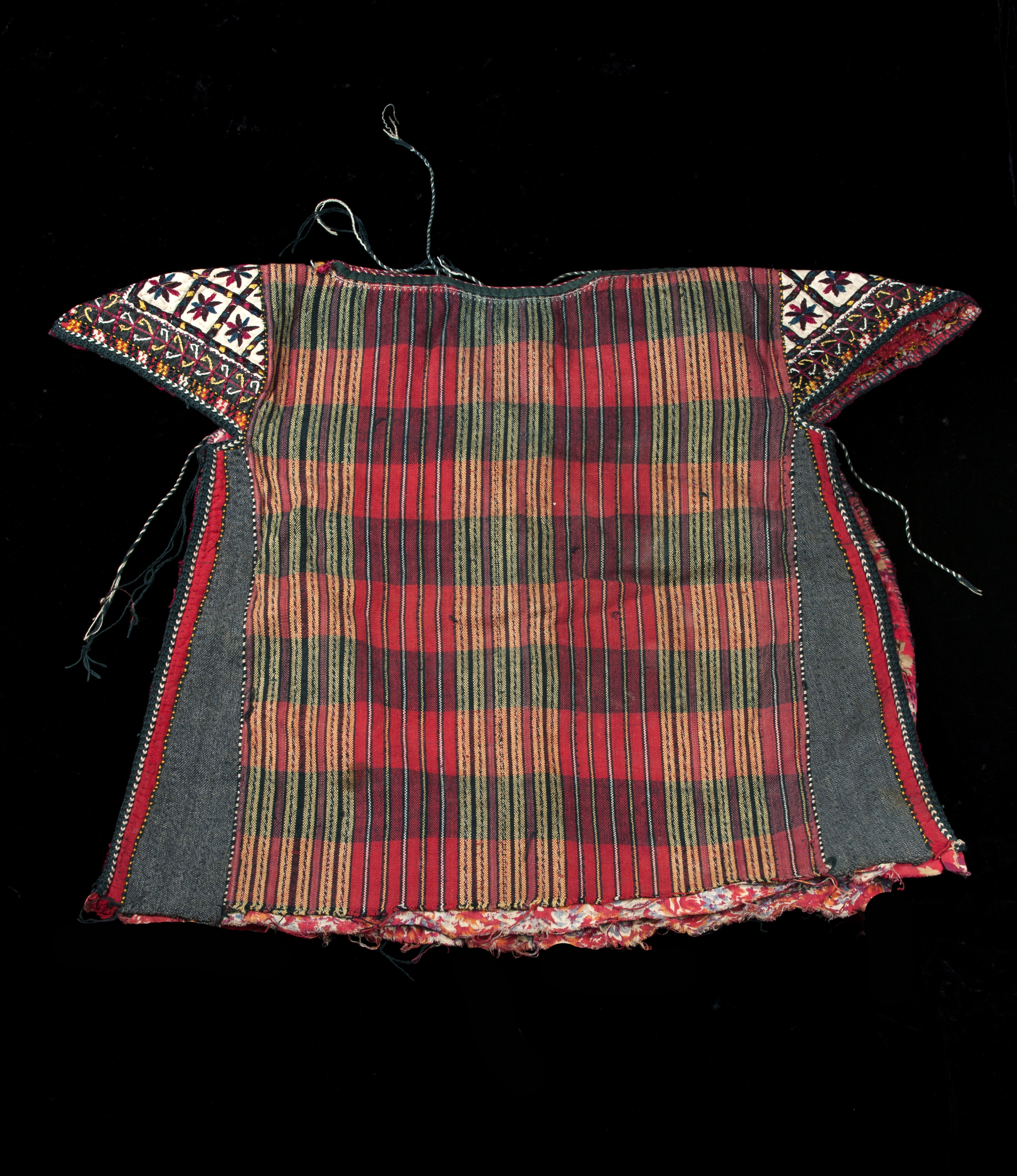 A Tekke Turkman child's smock with embroidered shoulders. 